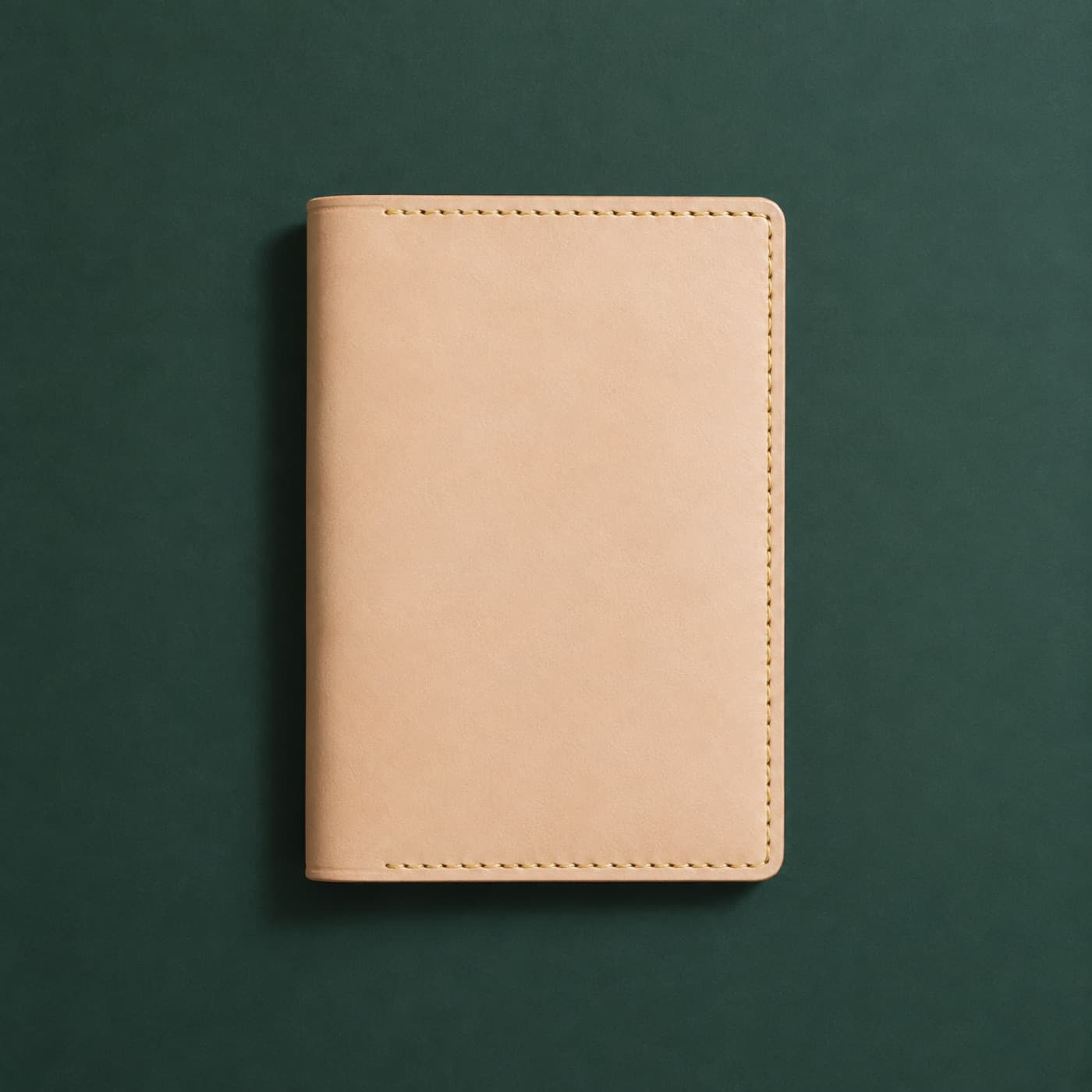 The same full-grain passport cover after 0 months of carry