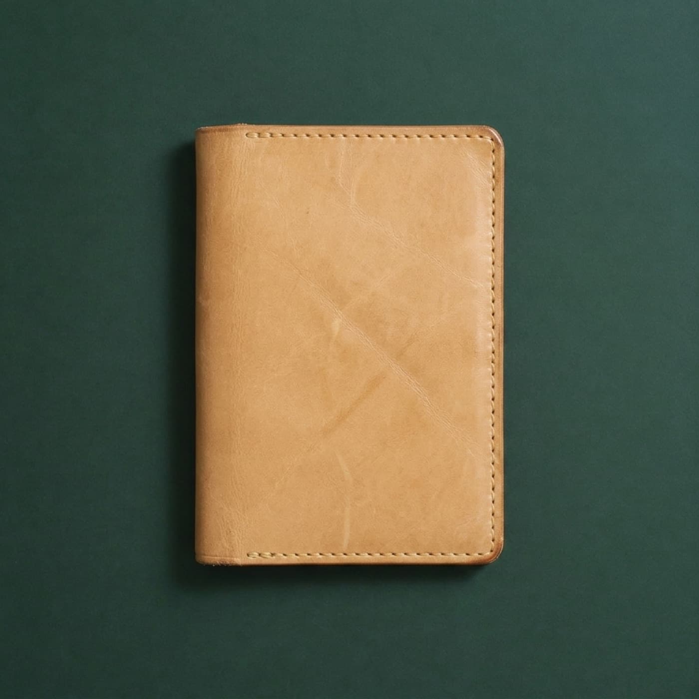 The same full-grain passport cover after 6 months of carry